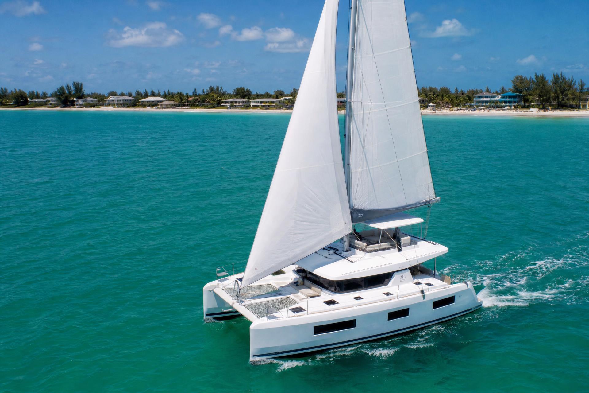 Luxury sailing catamaran cruising on turquoise Gulf waters